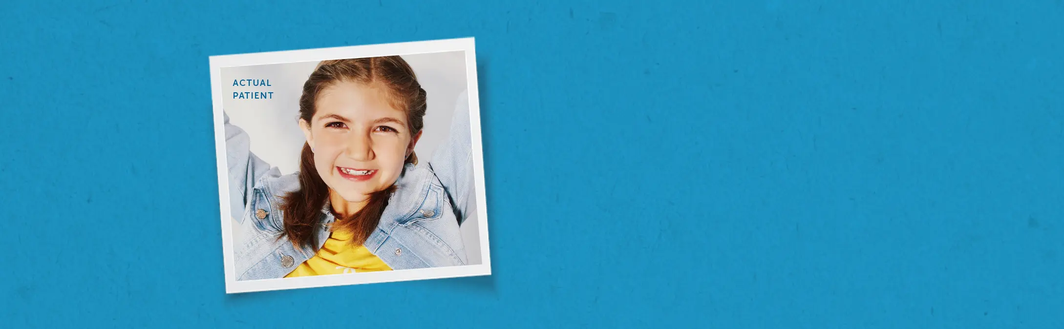 Girl smiling wearing a denim jacket