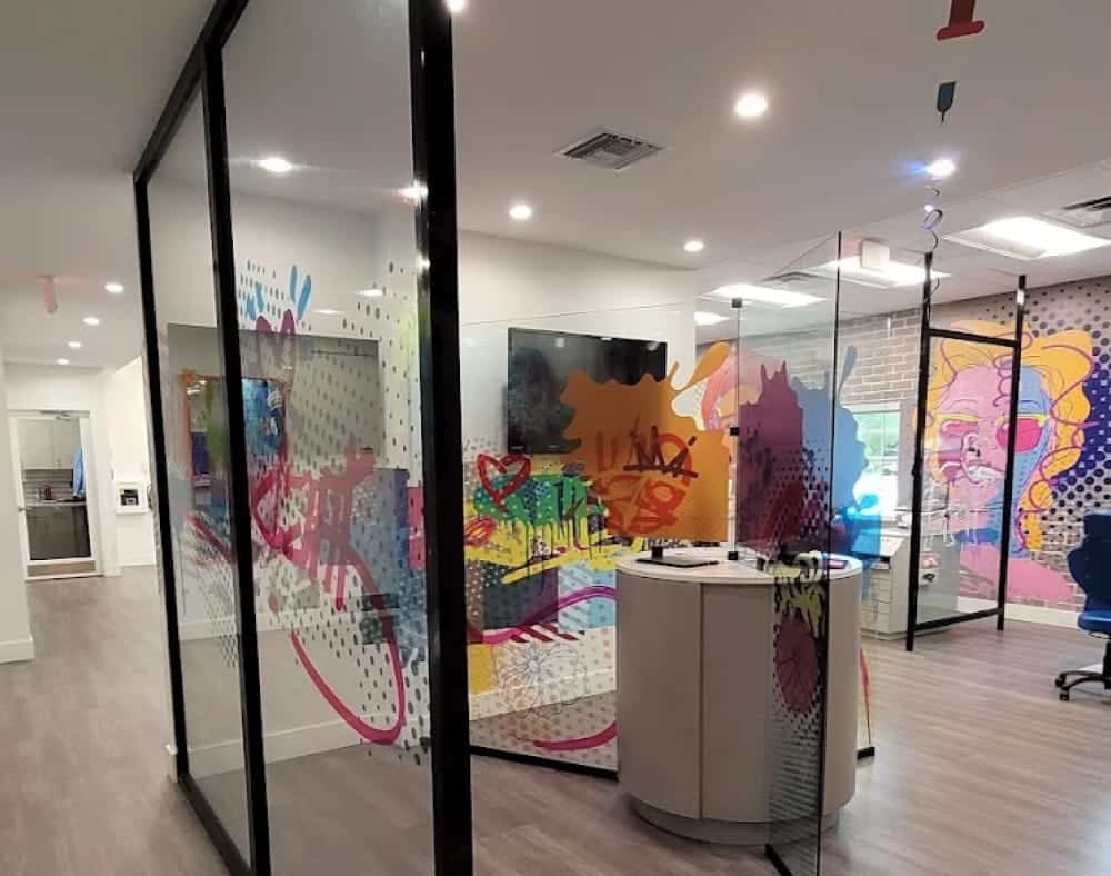 A modern pediatric dental office at the Jacaranda Smiles Plantation office.
